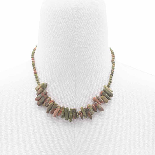 Longstone pendant necklace featuring mottled green and pink unakite gemstone beads on a delicate chain.