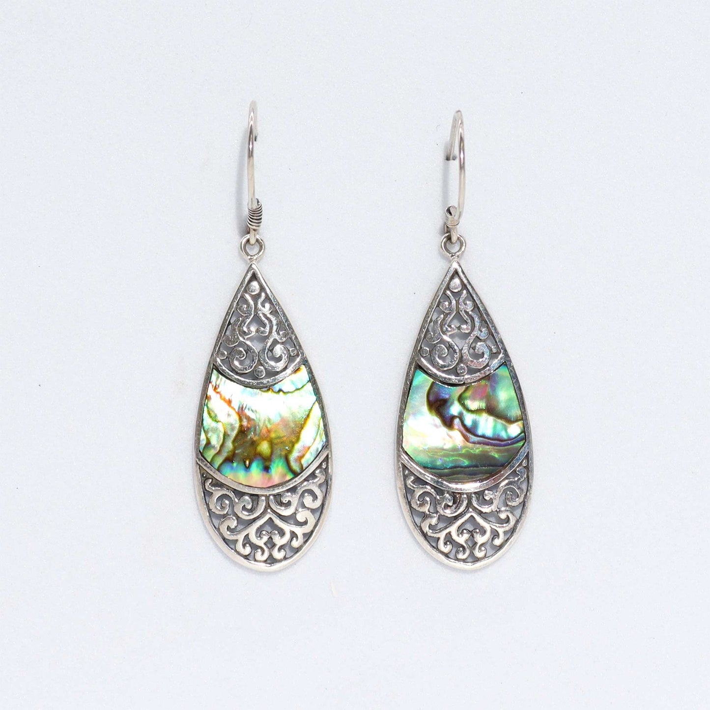Iridescent abalone shell oval teardrop earrings set in polished silver, showcasing vibrant blue and green ocean hues.
