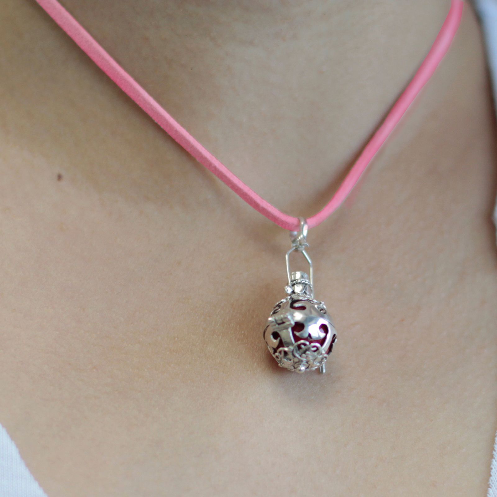 Intricately detailed 16mm 925 sterling silver angel bell pendant with a delicate spherical design and ornate metalwork.