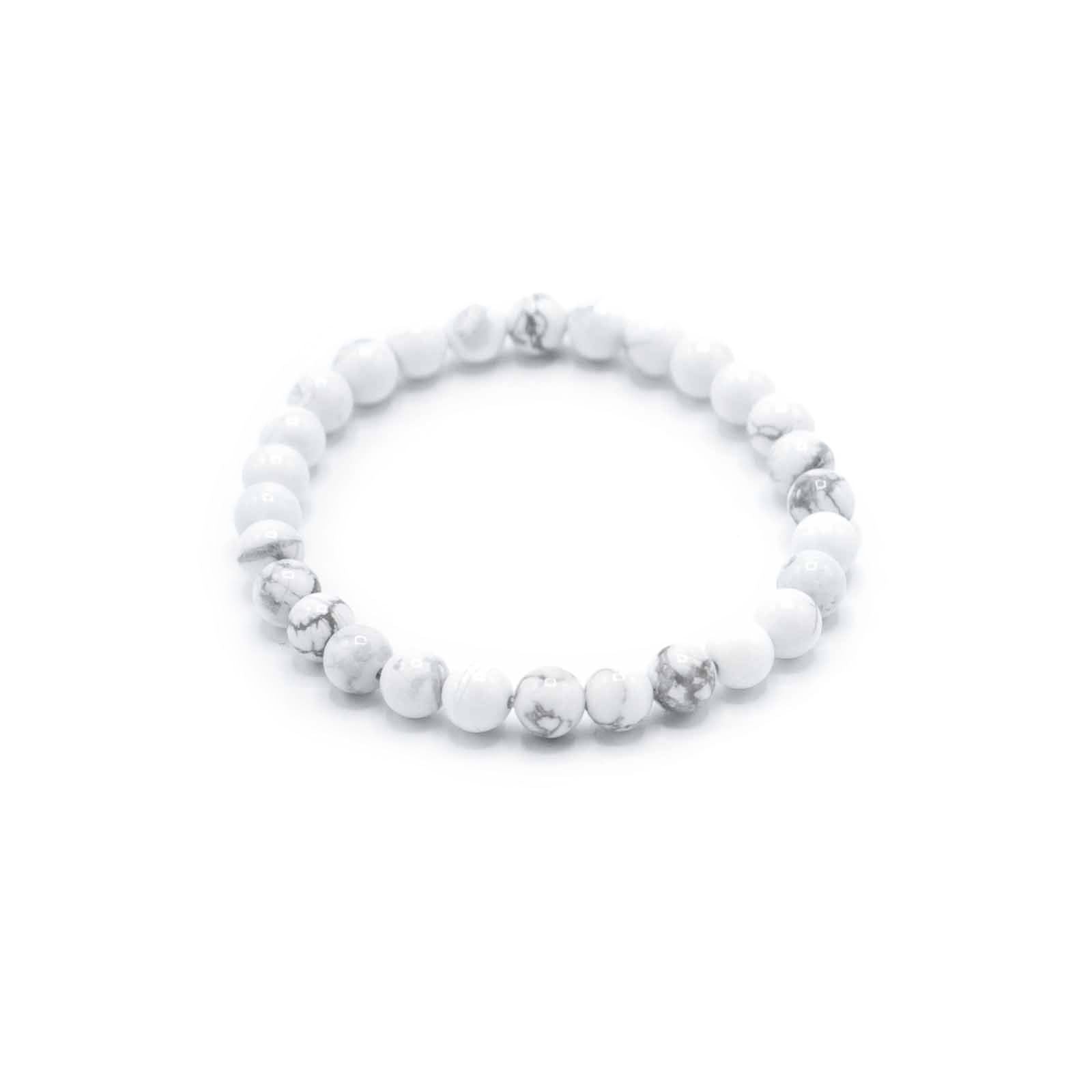 Elegant beaded bracelet featuring smooth white jasper gemstones on an adjustable cord for manifestation and peace.