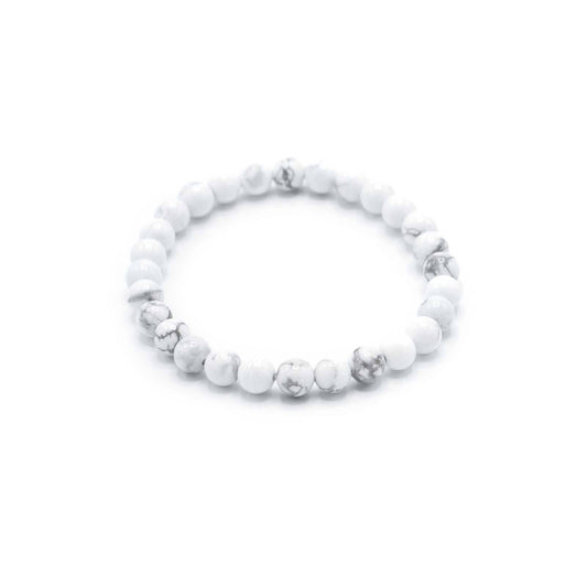 Elegant beaded bracelet featuring smooth white jasper gemstones on an adjustable cord for manifestation and peace.