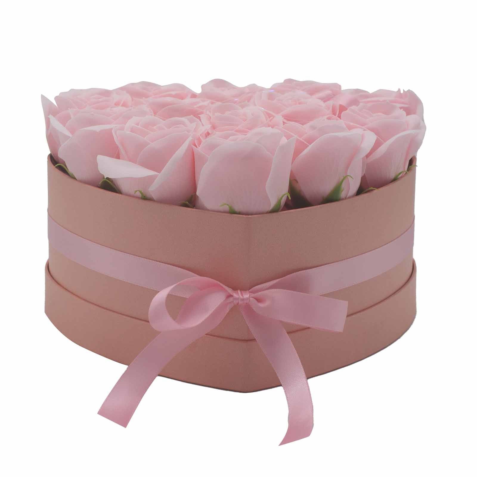 A heart-shaped gift bouquet featuring thirteen realistic pink soap roses arranged in an elegant presentation.