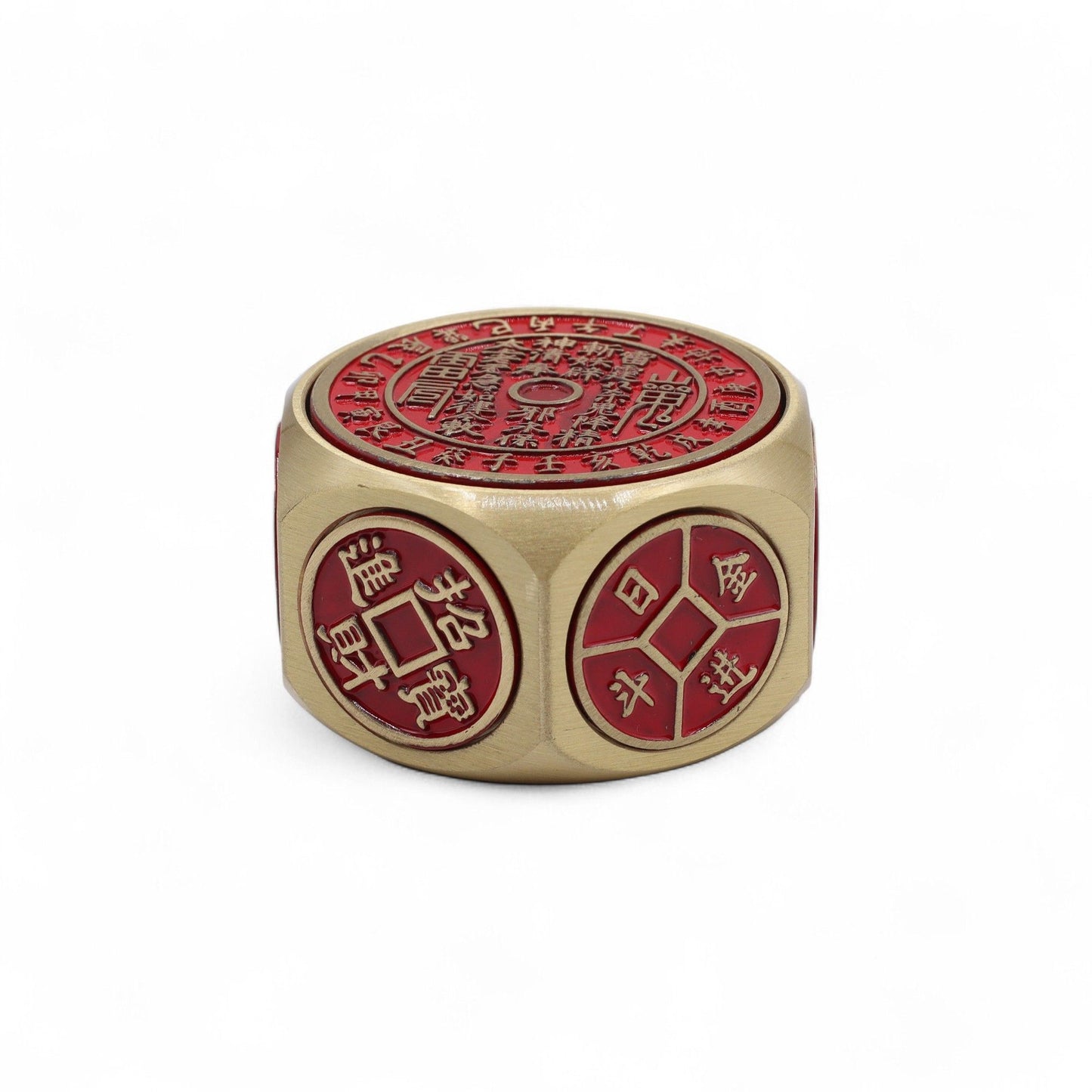 Circular red and brass-tone metal Feng Shui spinner engraved with Chinese coin symbols and a traditional calendar.
