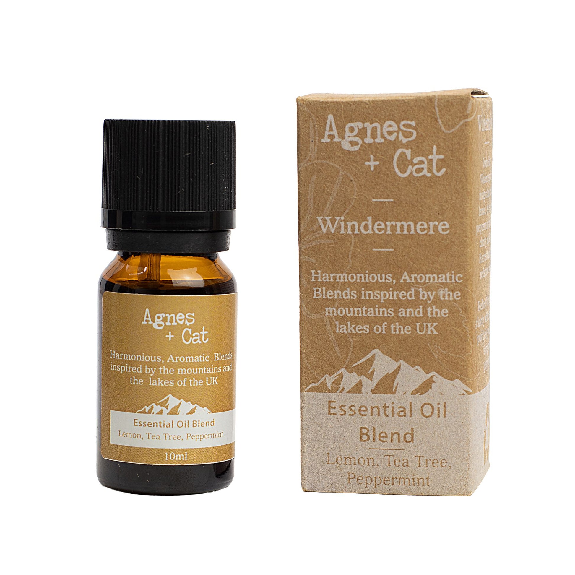 Bottle of clear essential oil blend featuring a minimalist label, surrounded by fresh lemon and herbal ingredients.