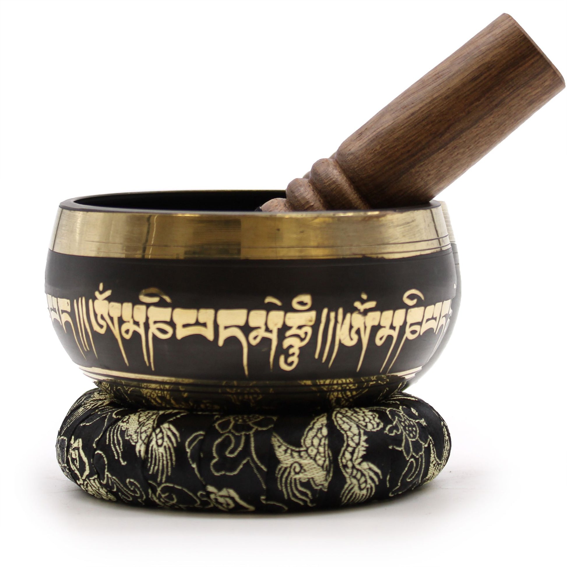 Handcrafted metal singing bowl featuring an intricate lotus flower design with a wooden striker and cushion.