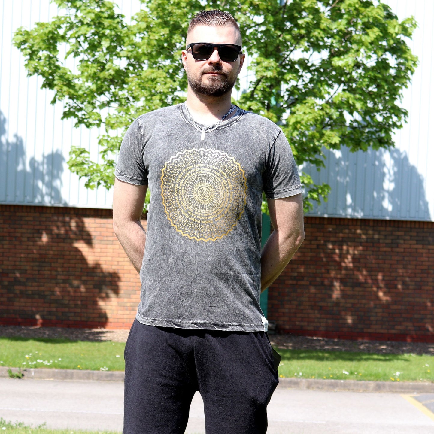 Dark grey stone washed T-shirt featuring a detailed white mandala design on the front.