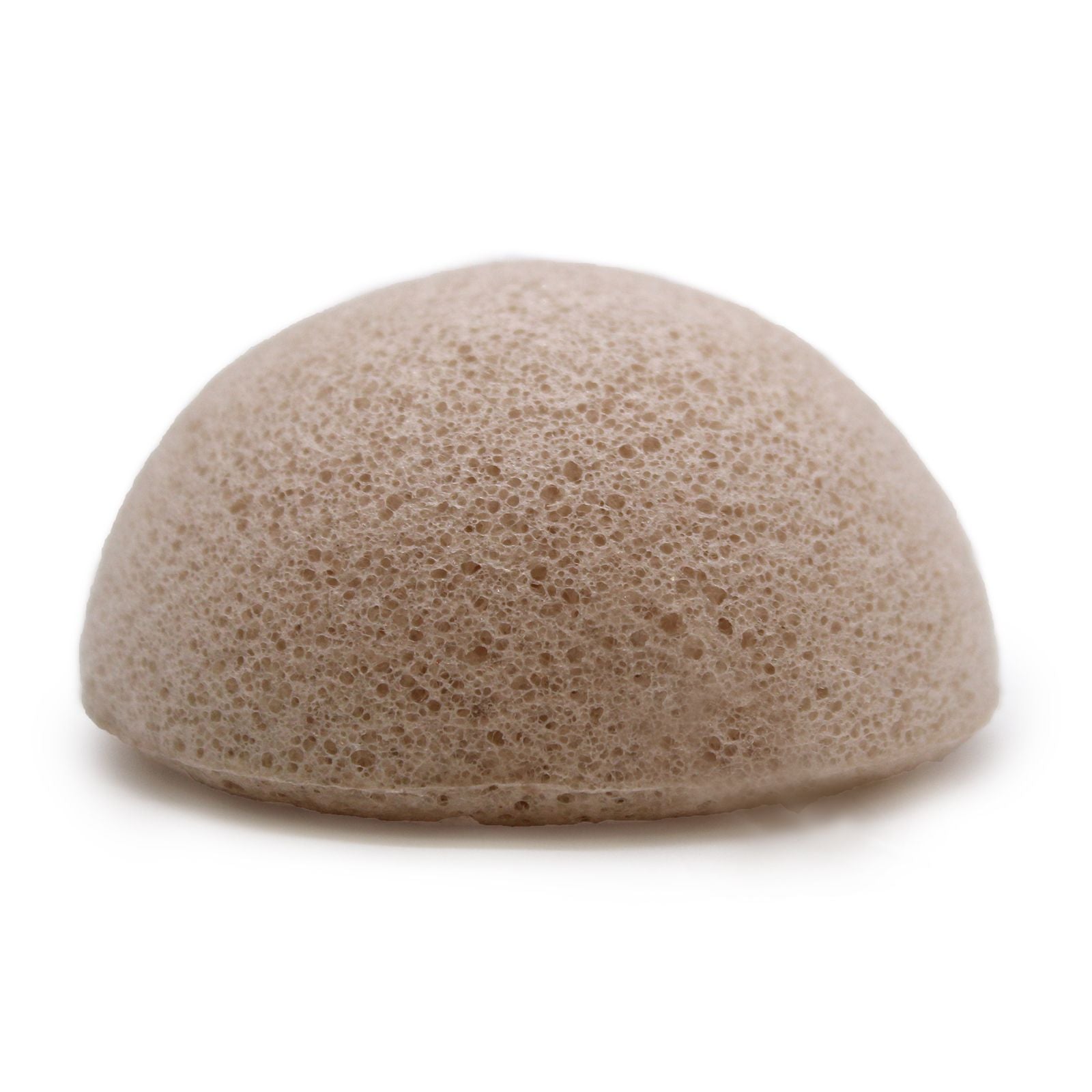 A round, textured natural white konjac sponge made from vegetable fibres for gentle facial cleansing.